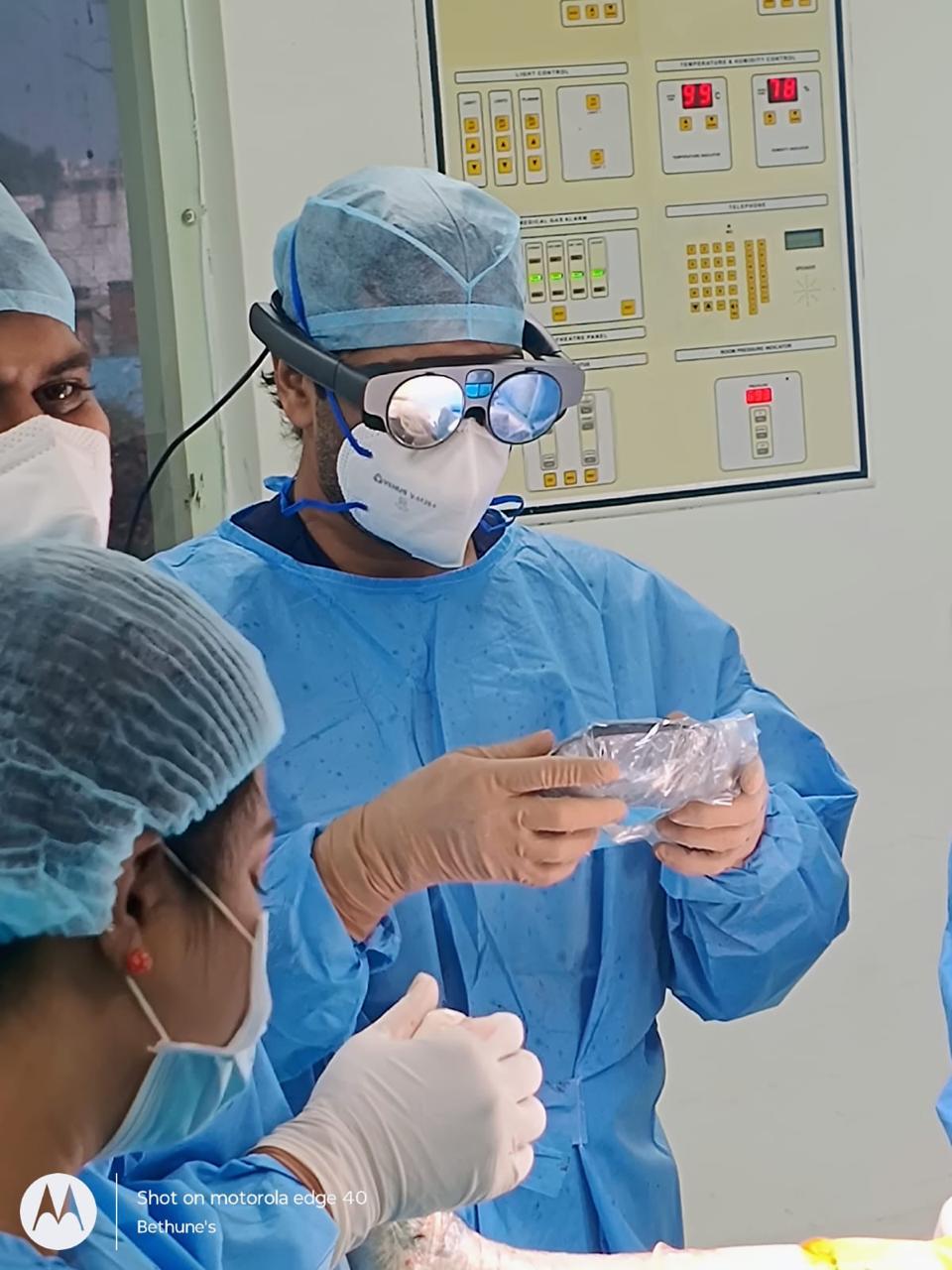 Surgeon wearing Magic Leap AR headset during 3D Robotics surgery.
